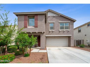Charming two-story home featuring a two-car garage and well-maintained landscaping at 12018 W Taylor St, Avondale, AZ 85323