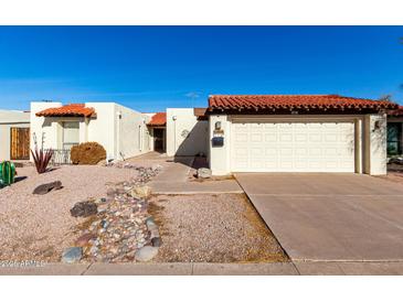 Charming home featuring a red tile roof, desert landscaping, and inviting curb appeal at 1500 N Markdale -- # 8, Mesa, AZ 85201