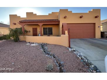 Charming single story home with beautiful xeriscape landscaping and covered entryway at 640 E Desert Canyon Rd, Wickenburg, AZ 85390