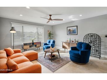 Bright living room with modern furniture, stylish decor, and ample natural light at 1407 E Laguna Dr, Tempe, AZ 85282