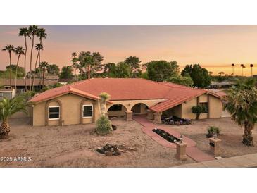 Expansive single-story home featuring a red tile roof, desert landscaping, and charming walkway at 2107 E Inca St, Mesa, AZ 85213
