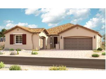 Single-story home featuring a tile roof, two-car garage, covered front porch, and low-maintenance desert landscaping at 21640 E Roundup Way, Queen Creek, AZ 85142
