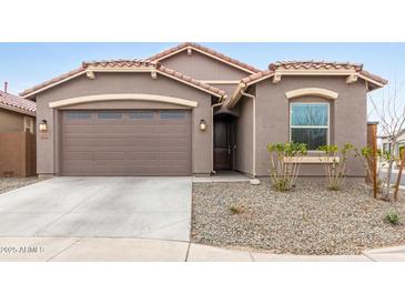 Charming single-story home featuring a two-car garage and a well-maintained front yard at 2235 W Park St, Phoenix, AZ 85041