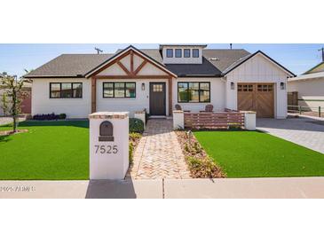 Charming home featuring a walkway, manicured landscaping, and welcoming front yard at 7525 E Latham St, Scottsdale, AZ 85257