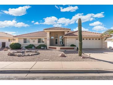 Charming single-story home features desert landscaping, covered entry, and a spacious two-car garage at 8303 E Monterey Ave, Mesa, AZ 85209