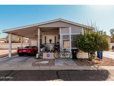 Charming single-story home with covered parking and landscaped front yard at 8700 E University Dr # 2616, Mesa, AZ 85207