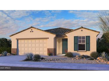 Charming single-story home showcasing a neutral color palette, a two-car garage, and desert landscaping at 16778 W Yucatan Dr, Surprise, AZ 85378