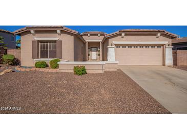 Well maintained single-story home with a two car garage and a low maintenance desert-scape front yard at 18750 E Ryan Rd, Queen Creek, AZ 85142