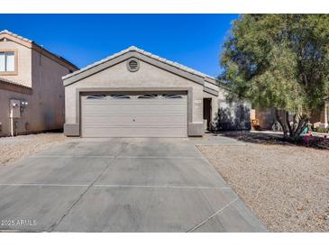 Charming one-story home with a two car garage, well-maintained landscaping, and neutral color palette at 12766 W Dreyfus Dr, El Mirage, AZ 85335