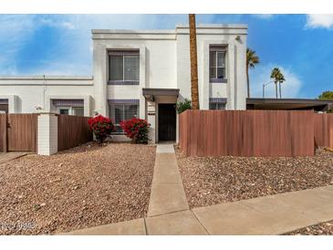 Inviting two-story townhome featuring a private entrance, desert landscaping and charming curb appeal at 13204 N 3Rd Way, Phoenix, AZ 85022