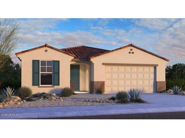 Inviting single-story home features a neutral color palette, clay tile roof, and a two-car garage at 16791 W Yucatan Dr, Surprise, AZ 85388