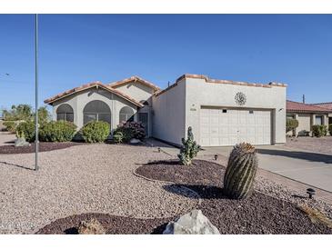 Charming single-story home featuring desert landscaping, neutral stucco exterior, and a two-car garage at 2159 Leisure World --, Mesa, AZ 85206