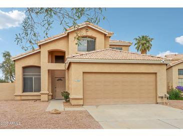 Attractive two-story home features a well-maintained yard and a two-car garage at 21960 N 70Th Dr, Glendale, AZ 85310