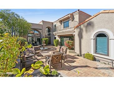 Charming courtyard with a fountain, brick patio, and comfortable seating area, perfect for outdoor relaxation at 7504 N Via De La Siesta --, Scottsdale, AZ 85258