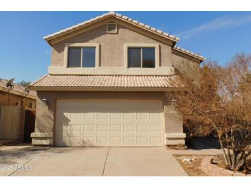 Charming two-story home with tile roof and a two-car garage at 7830 S 26Th St, Phoenix, AZ 85042