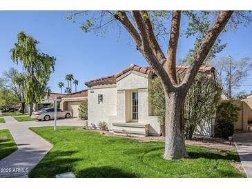 Charming single-story home featuring a red tile roof, stucco siding, and a well-maintained front yard at 11840 N 40Th Way, Phoenix, AZ 85028