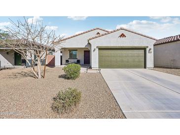 Charming single-story home features a well-maintained yard and an attached two-car garage at 45734 W Sky Ln, Maricopa, AZ 85139