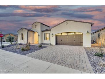 Charming home with a spacious driveway, a two-car garage, and well-maintained landscaping at 500 E Watermelon Ln, Queen Creek, AZ 85140