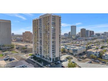 High-rise condo with city views and mature landscaping at 207 W Clarendon Ave # H10, Phoenix, AZ 85013