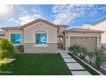 Charming single-story home with well-manicured turf and a terracotta tile roof at 23072 N 98Th N Dr, Peoria, AZ 85383