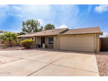 Charming single-story home featuring a well-maintained yard, large driveway, and a two-car garage at 3503 E Campo Bello Dr, Phoenix, AZ 85032