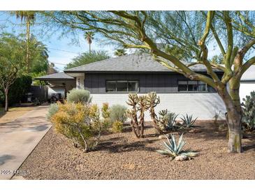 Charming home featuring desert landscaping, updated paint and modern architectural design at 4530 N 9Th Ave, Phoenix, AZ 85013