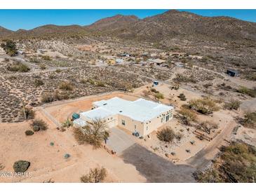 Expansive desert property featuring a modern home with a spacious driveway and beautiful mountain views at 50408 N 22Nd Ave, New River, AZ 85087