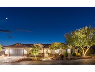 Charming single-story home with well-lit landscaping and a two-car garage at 5904 E Calle De Las Estrellas Rd, Cave Creek, AZ 85331