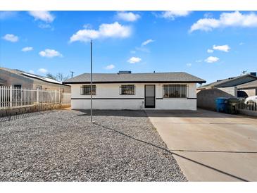 Charming single-story home featuring a gravel front yard and a driveway leading to the entrance at 737 W Jones Ave, Phoenix, AZ 85041