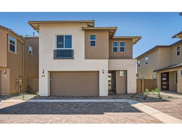 Beautiful two-story home featuring a two-car garage, desert landscaping, and a modern design at 10209 E Ursula Ave, Mesa, AZ 85212