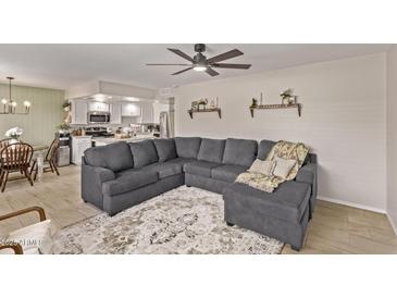 Bright living room featuring an open floor plan, modern ceiling fan and decor at 1310 S Pima St # 34, Mesa, AZ 85210