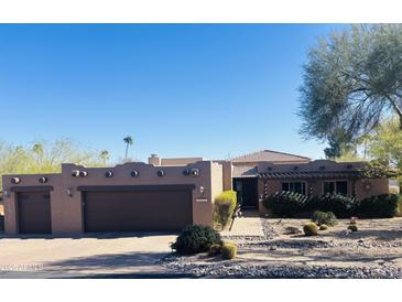 Charming southwest-style home with a private courtyard entrance and a well-maintained desert landscape at 25621 N Cordova Ln, Rio Verde, AZ 85263