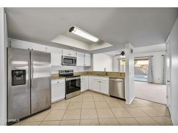 Bright kitchen featuring stainless steel appliances and granite countertops at 2706 W Estrella Dr, Chandler, AZ 85224