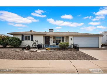 Charming single-story home with well-maintained landscaping and a welcoming front yard at 6329 E Dodge St, Mesa, AZ 85205