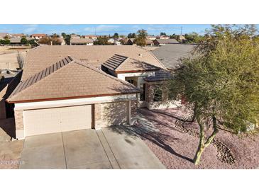 Beautiful single-story home featuring a spacious three-car garage and well-maintained landscaping at 801 S 120Th Ave, Avondale, AZ 85323