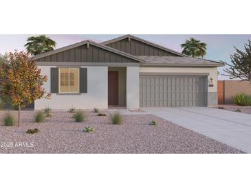 Charming single-story home with neutral tones, complemented by desert landscaping and a two-car garage at 12651 W Parkway Ln, Avondale, AZ 85323