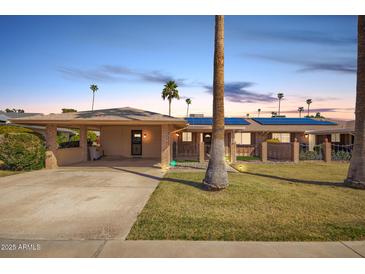 Charming single-story home with desert landscaping, covered parking and solar panels in a quiet neighborhood at 13621 N Emberwood Dr, Sun City, AZ 85351