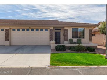 Charming single-story home with a well-manicured lawn and a two-car garage at 2662 S Springwood Blvd # 461, Mesa, AZ 85209