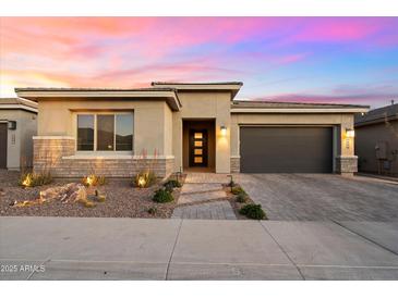 Inviting single-story home featuring a neutral palette, a two car garage, and stylish desert landscaping at 2843 E Los Gatos Dr, Phoenix, AZ 85050