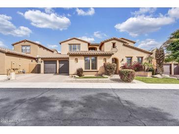 Beautiful two-story home with a three-car garage and a tile roof at 5636 E Libby St, Scottsdale, AZ 85254