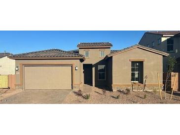 Single-story home with a two car garage, neutral colored stucco, and a well-kept desert landscape at 5915 S Romano --, Mesa, AZ 85212