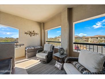 Inviting balcony with comfortable seating, offering scenic views and fresh air at 19700 N 76Th St # 2044, Scottsdale, AZ 85255