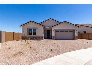 Beautiful single-Gathering home featuring a two-car garage and low-maintenance desert landscaping at 25393 N 158Th Ct, Surprise, AZ 85387