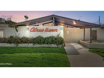 Inviting Citrus Manor entrance featuring well-manicured lawn, a striking brick facade, and clear signage at 4203 N 36Th St # 23, Phoenix, AZ 85018