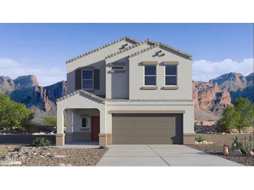 Charming two-story home with desert landscaping, covered porch, and attached two-car garage at 5106 E Umber Rd, San Tan Valley, AZ 85143