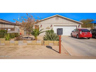 Charming single-story home with well-maintained landscaping and inviting curb appeal in a residential neighborhood at 354 W Bealey Ave, Coolidge, AZ 85128