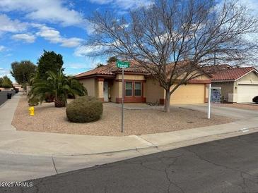 Charming single-story home with a low-maintenance desert landscaped front yard at 5622 E Emerald Cir, Mesa, AZ 85206