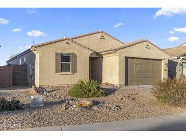 Charming single-story home with desert landscaping and a two-car garage at 864 W Blue Ridge Dr, San Tan Valley, AZ 85140