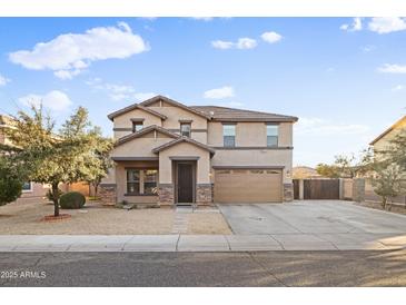 Charming two-story home with desert landscaping, covered entry, and a two car garage at 925 E Doris St, Avondale, AZ 85323