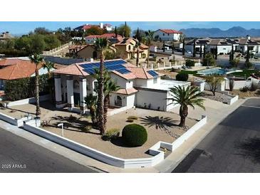 Stunning tile roof home with solar panels, well manicured landscape, and inviting curb appeal at 14401 N 29Th St, Phoenix, AZ 85032